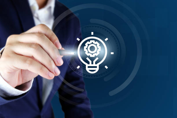istock Businessman pointing a bulb icon. 1140624958