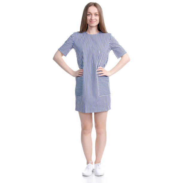 istock Woman in blue dress standing looking 1140626361
