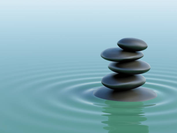 ターコイズブルーの水の中の石のバランス - stone zen like buddhism balance ストックフォトと画像