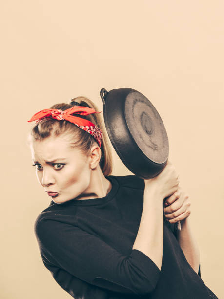 istock Kitchen fight with retro girl. 1140631688