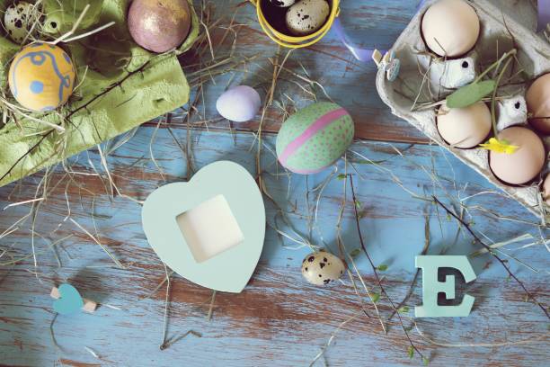 istock Eggs, quail, easter decor on a blue wooden table, top view 1140635723