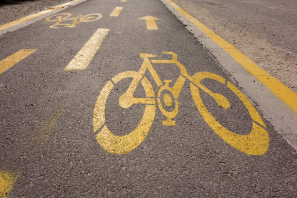 istock bicycle lane sign on the road 1140641612