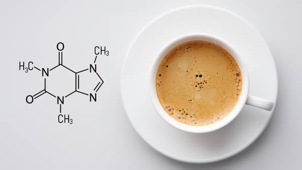 Cup of fresh coffee on white background. Blackboard with the chemical formula of Caffeine. Top view with copyspace Cup of fresh coffee on white background. Blackboard with the chemical formula of Caffeine. Top view with copyspace caffeine molecule stock pictures, royalty-free photos & images