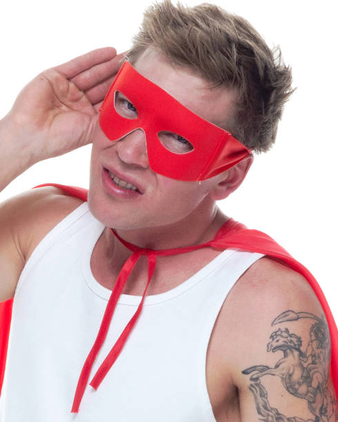 istock Man wearing pajamas and super hero cape 1140647139