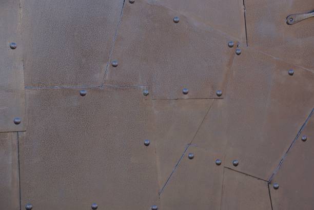 istock brown metal texture of iron wall with seams 1140651086