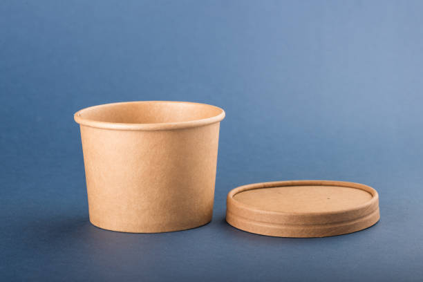 istock Disposable paper container with cap for soup on a blue background 1140652588