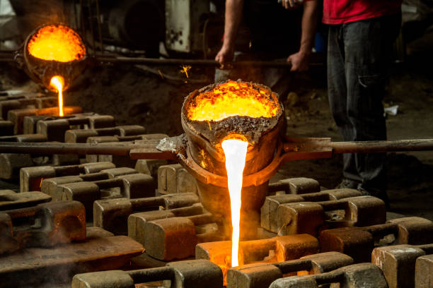 istock metal casting process with red high temperature fire in metal part factory 1140653587