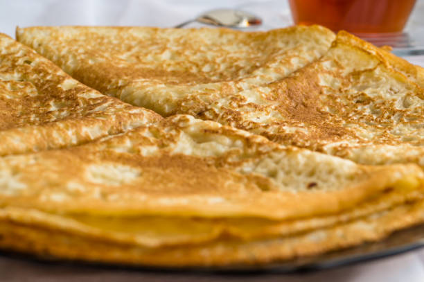 istock Russia, Severodvinsk, a stack of homemade Russian pancakes in the form of a triangular envelope, selective focus 1140654174