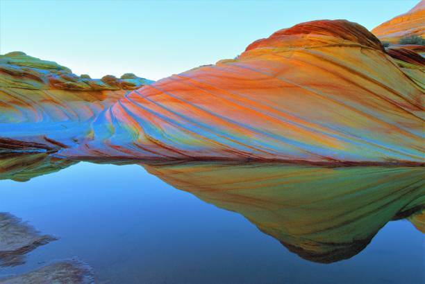 Sandstone Prism 4 The "wave", Coyote Buttes, Vermilion Cliffs National Monument, Arizona and Utah, U.S.A.  Water and quartz in the rock together bend light like an opal gemstone.  Creating the colors of a rainbow or prism. the wave arizona stock pictures, royalty-free photos & images
