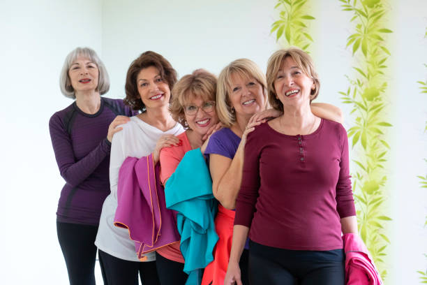 istock Senior women practicing  yoga in yoga studio 1140662239
