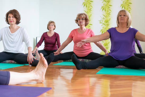 istock Senior women practicing  yoga in yoga studio 1140662784