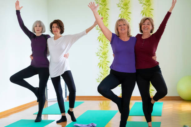 istock Senior women practicing  yoga in yoga studio 1140662811