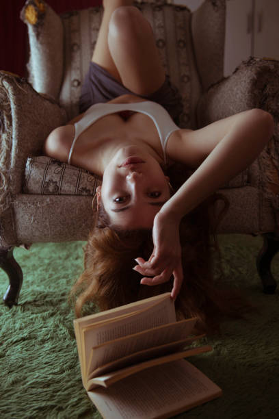 istock Beautiful Woman Finger on Book 1140663289