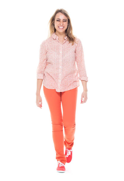 istock Beautiful white female in bright clothes - walking 1140665907