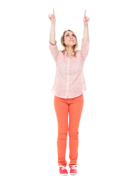 istock Beautiful female showing / pointing 1140666022