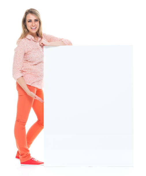 istock Beautiful female with big placard - showing 1140666058