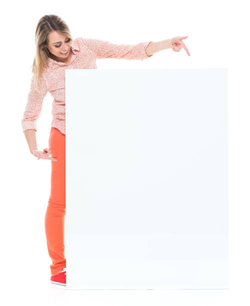 istock Beautiful female with big placard - pointing 1140666104