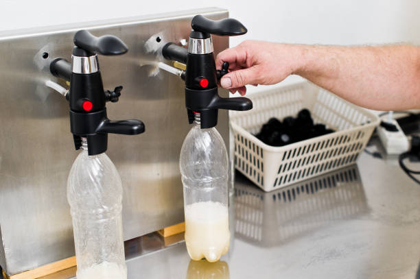 istock Bottling factory - Beer bottling line for processing and bottling beer into bottles. 1140668730