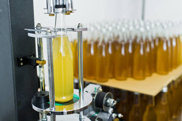 istock Bottling factory - Beer bottling line for processing and bottling beer into bottles. 1140670860