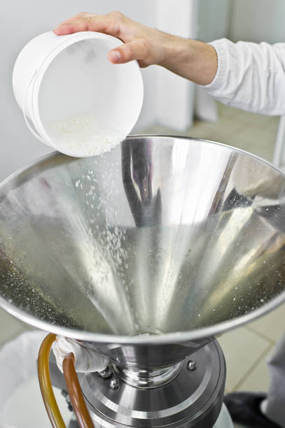 istock work sleeps coconut chips in an industrial crusher - press. Food production 1140671436