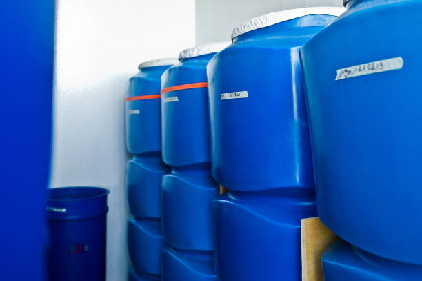istock plastic barrel. Barrel on a pallet with a metal frame. Shipment of chemicals. Plastic container for liquids. 1140671609