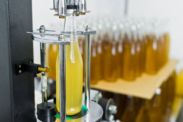 istock Bottling factory - Beer bottling line for processing and bottling beer into bottles. 1140671661