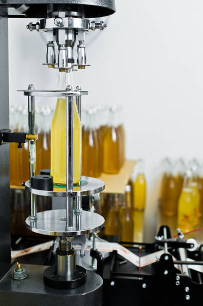 istock Bottling factory - Beer bottling line for processing and bottling beer into bottles. 1140672326