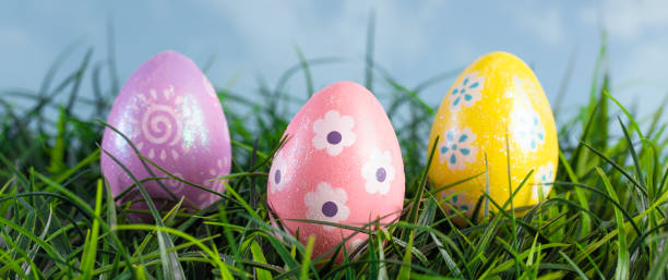 istock Decorated Easter Eggs Hiding in the Grass on a Beautiful Spring Day 1140675375