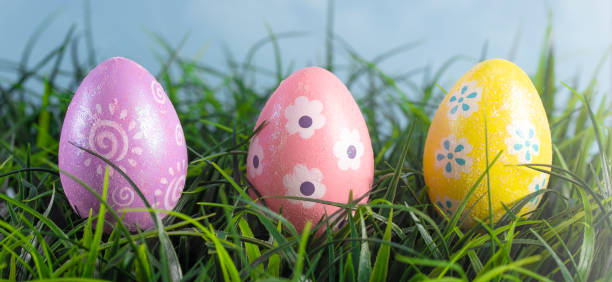 istock Decorated Easter Eggs Hiding in the Grass on a Beautiful Spring Day 1140675413