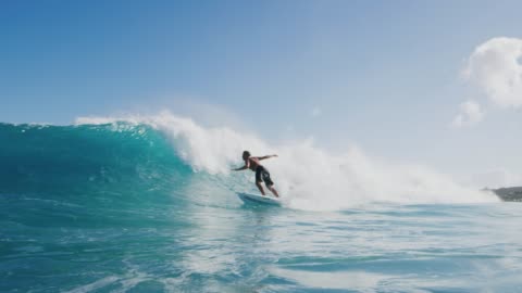 Young surfer ripping gnarly turn