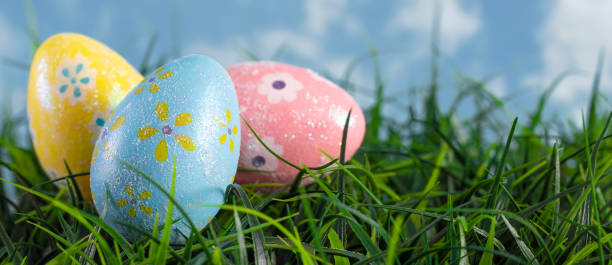 istock Decorated Easter Eggs Hiding in the Grass on a Beautiful Spring Day 1140675462