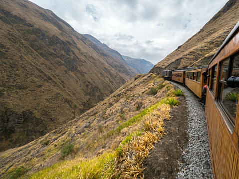 A train climbing the Nariz Del Diablo (Devil's Nose) - the famous part of the national railway of Ecuador near Alausi in the Chimborazo province. This engineering work is among the most audacious projects realized in the Andean mountain range.