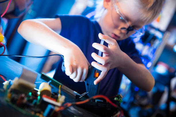 istock Boy and hot glue gun 1140682910