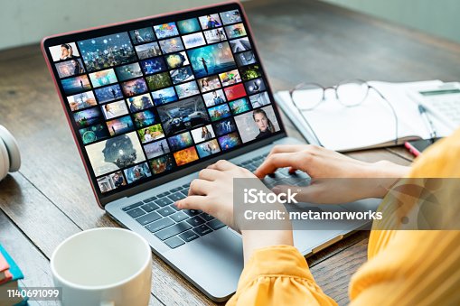 istock Young woman using a laptop computer. Graphic designer. UX design. 1140691099