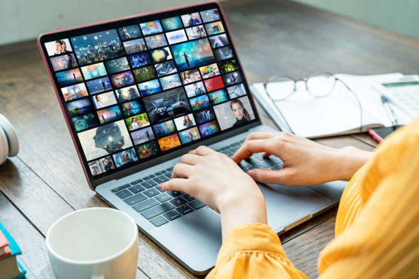 Young woman using a laptop computer. Graphic designer. UX design. Young woman using a laptop computer. Graphic designer. UX design. image stock pictures, royalty-free photos & images