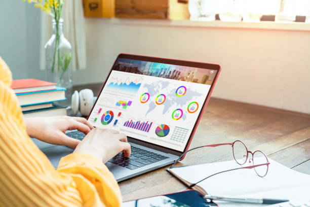 Young woman using a laptop computer. Graphic designer. UX design.
