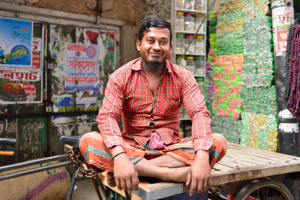 Delhi, India - February 7, 2017: A store on an old corridor in the Indian capital, Delhi. The shopkeeper is selling daily necessities.