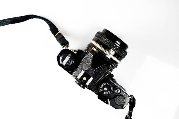 istock Black old vintage camera isolated on white background. 1140693162