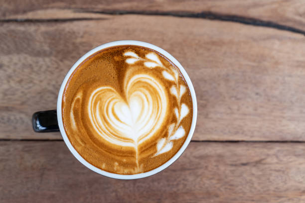 istock Hot art coffee cappuccino in a cup on wooden table background  with copy space 1140693758