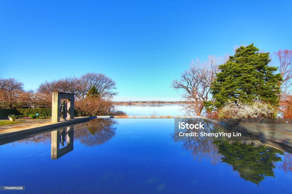 Dallas Arboretum and Botanical Gardens with blue sky, reflection lake Reflection lake Dallas - Texas Stock Photo