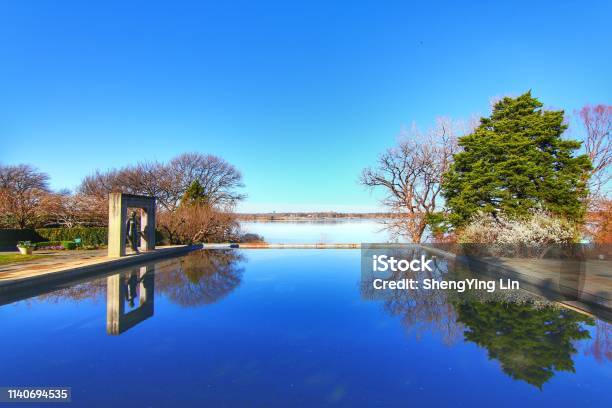 Dallas Arboretum And Botanical Gardens With Blue Sky Reflection Lake Stock Photo - Download Image Now