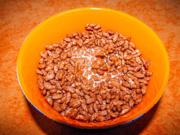 istock Ceramics bowl with chocolate rice cereal in milk over a table with tablecloth 1140694851