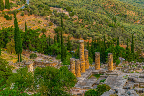 sunset view of ruins of temple of apollo at ancient delphi, greece - 3666 imagens e fotografias de stock
