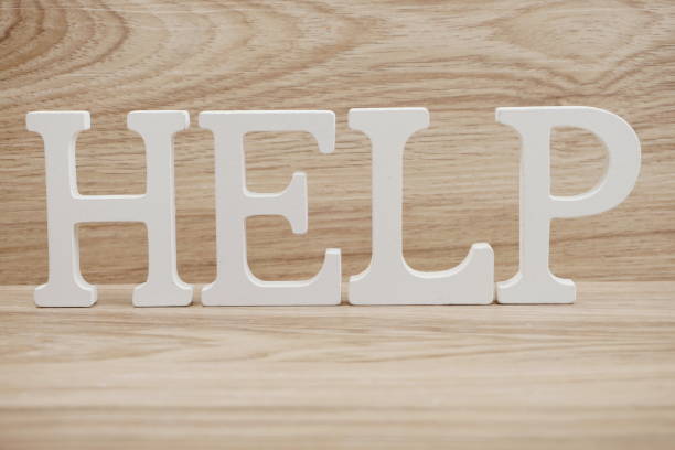 istock Help word alphabet letters on wooden background 1140697380