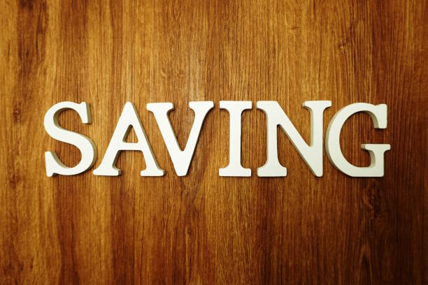 istock Saving alphabet letters on wooden background 1140702054