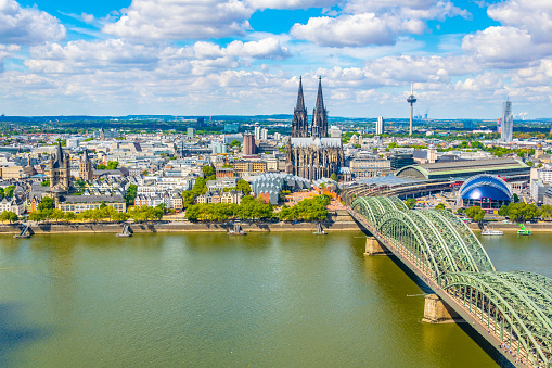 Aerial view of cityscape of Cologne with Hohenzollern bridge, cathedral and Saint Martin church, Germany
