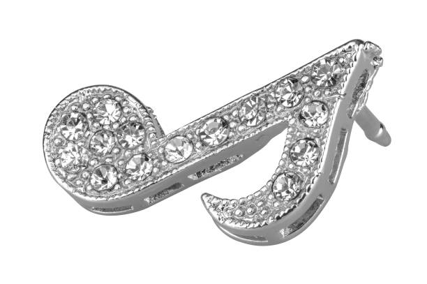 istock Silver brooch shaped like a musical note, with small diamonds, isolated on white background, clipping path included 1140708785