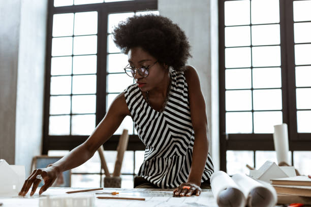 istock Interior designer wearing striped blouse working hard 1140713555