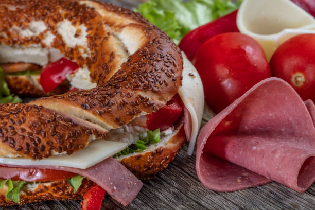 istock Turkish Bagel, Simit Sandwich with cheese, tomato, red pepper, cheddar cheese, ham. 1140716366