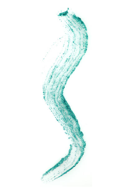 istock Cosmetic turquoise glitter eyeliner brush stroke sample, isolated on white background 1140716417